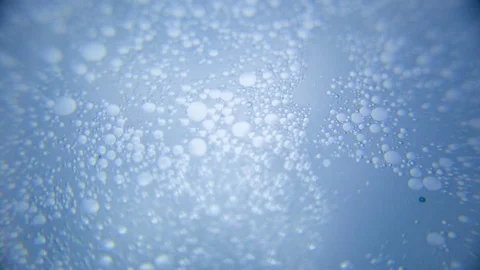 Bubbles floating on water Stock Footage 76102694