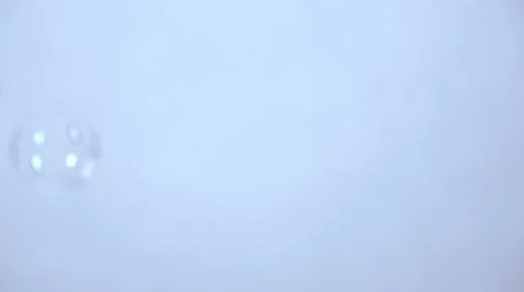 Bubbles fly cross picture in slow motion, white background Stock Footage 58761225