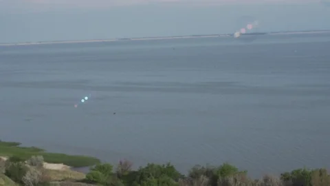 Bubbles fly over a canyon and the sea, slow motion. Nature reserve. Eco-friendly Video stock 103839006