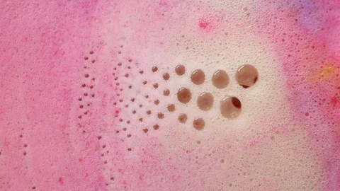 Bubbles of foam bath bomb close-up pink texture Stock Footage 113191406