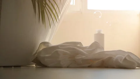 Bubbles of foam fall on the bathroom floor Stock Footage 138893713