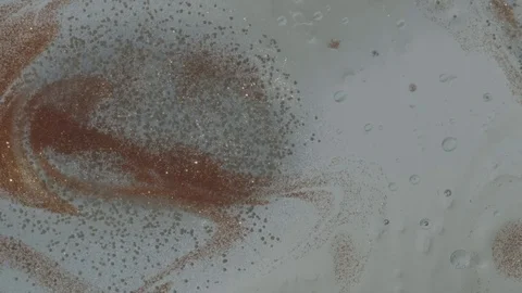 Bubbles form in background with colored glitter Stock Footage 77779671