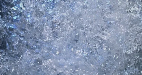 Bubbles forming and rising in clear water during daylight hours in a calm settin Stock Footage 331383585