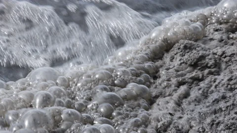 Bubbles forming in polluted water Stock Footage 131486827