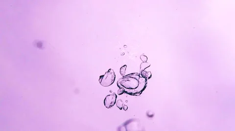 Bubbles Gently Surfacing Against a Blue Sky From an Underwater Perspective. Stock-Footage 51167074