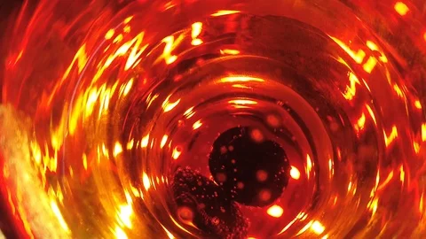 Bubbles in a glass of drink top view. abstract red background Video stock 127433875