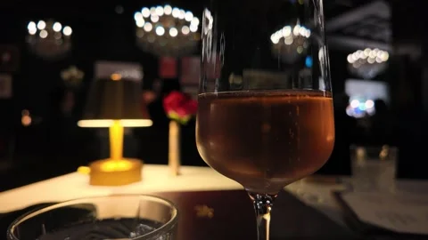 Bubbles in a Glass at a Luxurious Restaurant Setting Stock Footage 301230464