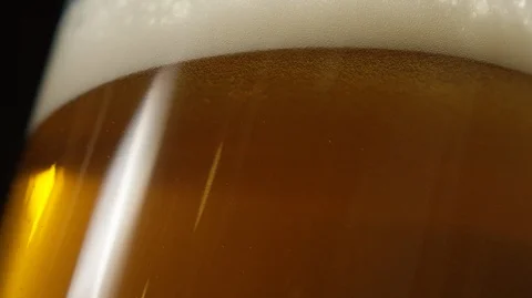 Bubbles go up in the glass of beer Stock Footage 127837166