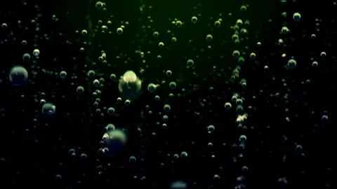 Bubbles go up underwater over green background liquid Video stock 110706576
