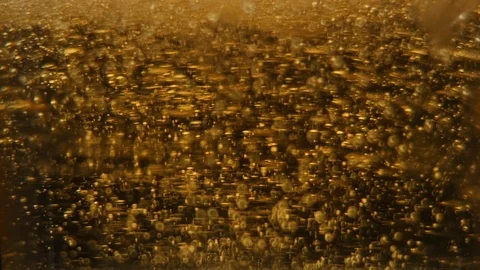 Bubbles in golden jelly Stock Footage 94827365