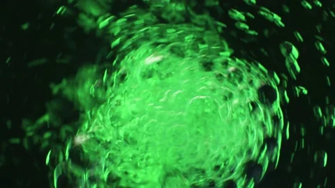 Bubbles in green colored water Stock Footage 135357491