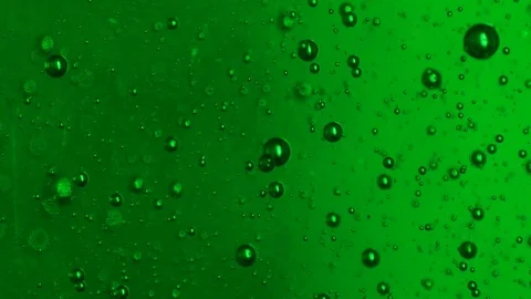 Bubbles in Green Liquid - Macro Photography Stock Footage 125544239