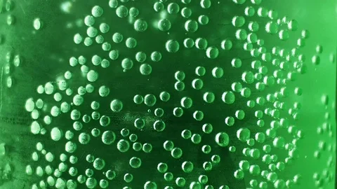 Bubbles in a green plastic soda bottle and light Stock Footage 104768490