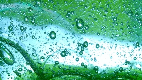 Bubbles on green slow motion Stock Footage 128239516