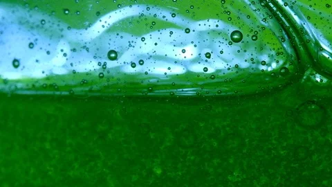 Bubbles on green slow motion Stock Footage 128240769