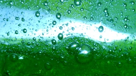 Bubbles on green slow motion Stock Footage 128242141