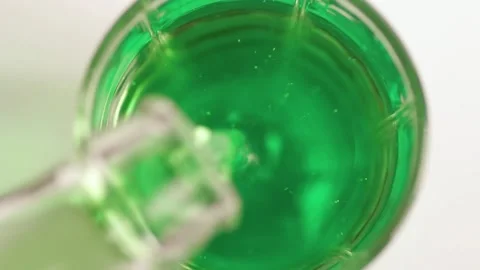 The bubbles in the green soda go up and burst Stock Footage 134908367