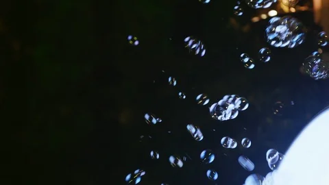 Bubbles illuminated at night Vídeos de archivo 88345332