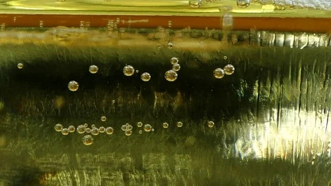Bubbles inside a glass of champagne or cider 스톡 동영상 83111474