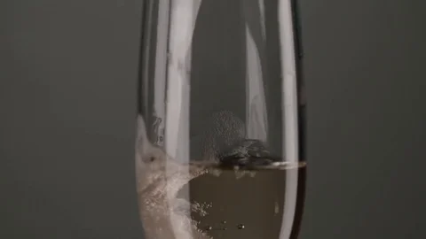 Bubbles inside a glass of champagne. Slow motion Stock Footage 78484474