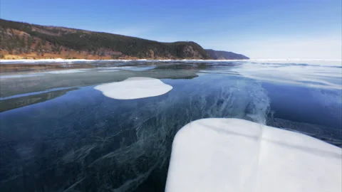 Bubbles inside ice on frozen Baikal lake Stock Footage 175613508