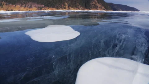 Bubbles inside thick clear transparent ice on frozen Baikal lake Video stock 177230969