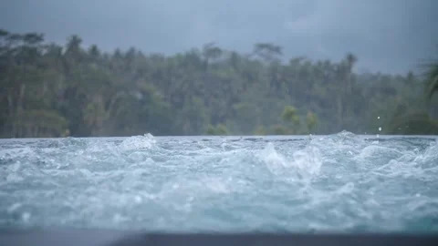 Bubbles in the jacuzzi with a view of the jungle 110 Stock Footage 264574281