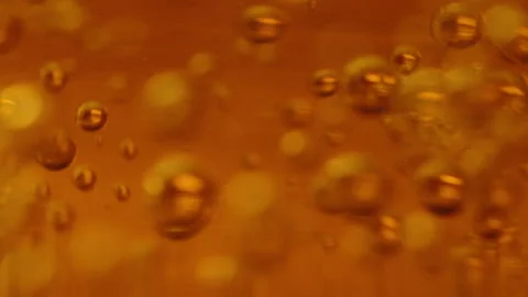 Bubbles in liquid in glass Stock Footage 274688680