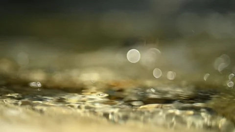 Bubbles on a mountain river with background blur (bokeh, close up, slow motion) Video stock 211756391