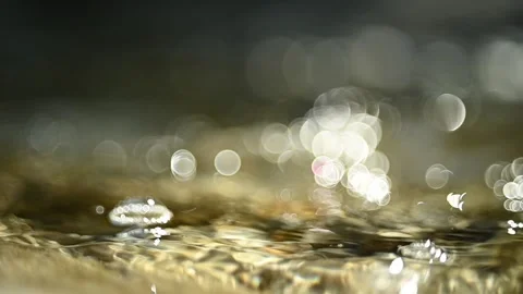 Bubbles on a mountain river with bubble bokeh (close up, slow motion) Stock Footage 211756258