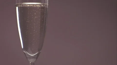 Bubbles Move in Slow Motion Inside Champagne Glass Stock Footage 75942380