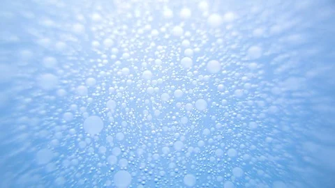 Bubbles moving in blue water Stock Footage 76102747