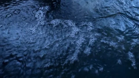 Bubbles moving on surface of Japanese hot spring pool water Stock Footage 303251982