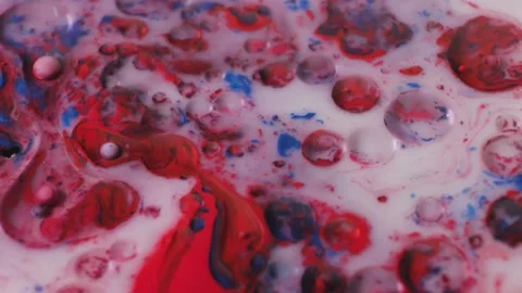 Bubbles of oil in liquid paint and white milk create a stunning view, like the Stock Footage 170303450
