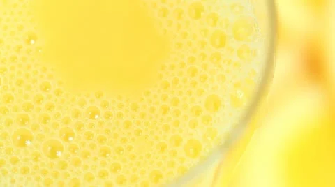 Bubbles in orange juice Stock Footage 9064285