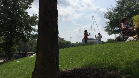 Bubbles in Park Stock Footage 129054119