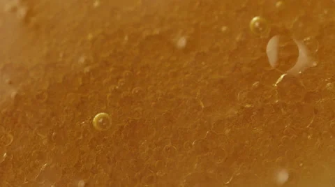 Bubbles pattern in flower oil Stock Footage 65873874