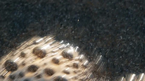 Bubbles pop on the beach Stock Footage 123394727