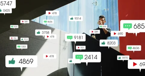 Bubbles popping, man in dark top stepping atrium stairs, drinking cup, checking Stock Footage 332285276