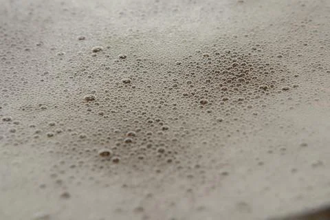 Bubbles of a poured drink in macro. Circles white in blur Stock Photos