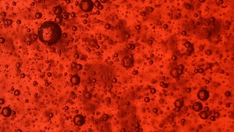 Bubbles on red background slowmotion Stock Footage 128243489