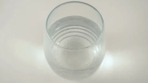 Bubbles Rise in a Glass of Seltzer in Slow Motion Stock Footage 74608358