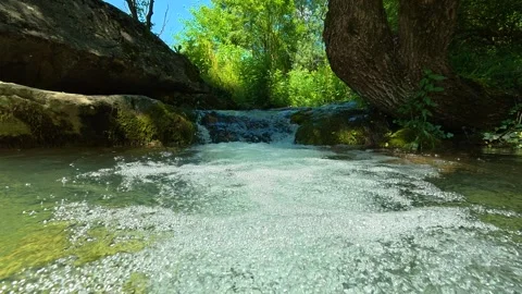 Bubbles rise through clear, greenish water. Gradasnica River Canyon, Serbia Stock-Footage 342321220