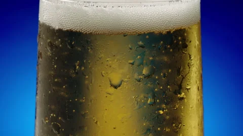 Bubbles rising in a cold glass of beer Stock Footage 154127458