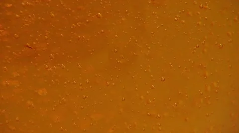 Bubbles rising in energy drink Stock Footage 55296690