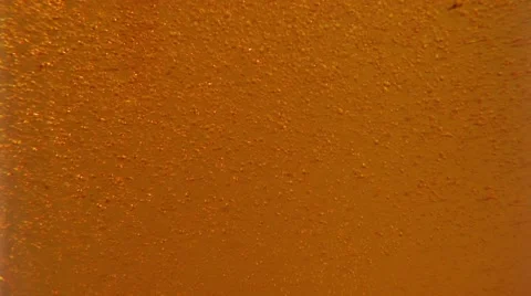 Bubbles rising in energy drink Stock Footage 55296845
