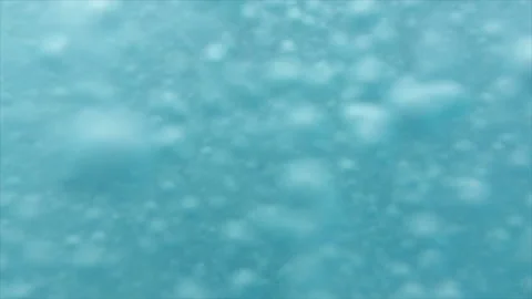 Bubbles rising in the pool in slow motion. Stock Footage 232429143