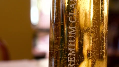 Bubbles rising in a premium class beer glass Stock Footage 339231554