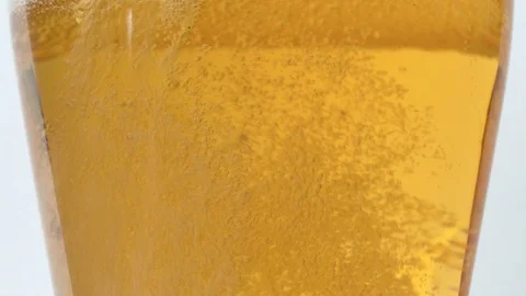 Bubbles rising to the surface of beer Stock Footage 124042698