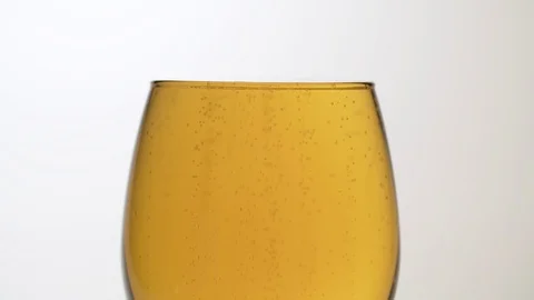 Bubbles rising to the surface of beer Stock Footage 124553770